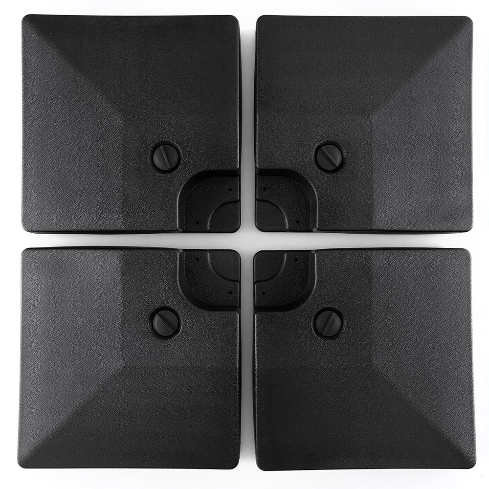 Four stackable black plates of a 20L cantilever offset patio umbrella base, designed for easy transport and storage.