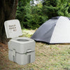 Portable 5.3-gallon travel toilet with piston pump flush, designed for camping and outdoor activities, featuring a.