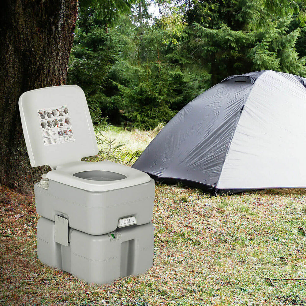 Portable 5.3-gallon travel toilet with piston pump flush, designed for camping and outdoor activities, featuring a.