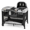 5-in-1 portable baby playard in black with cradle, storage basket, and mesh netting for ventilation and visibility.