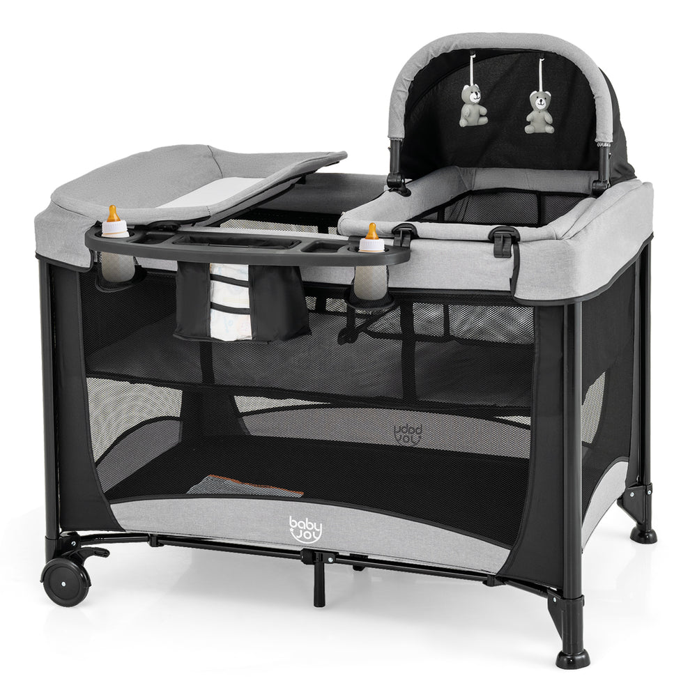 5-in-1 portable baby playard in black with cradle, storage basket, and mesh netting for ventilation and visibility.