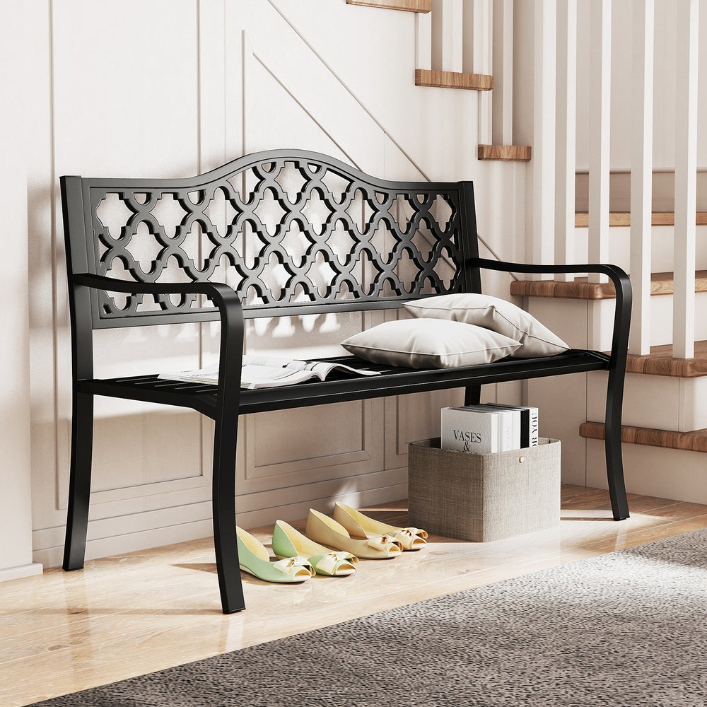 Black patio bench with curved armrests, seating 2-3 people, featuring elegant backrest patterns for outdoor relaxation.