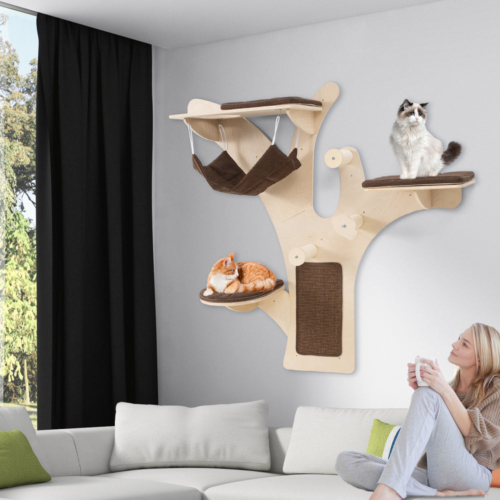 Wall-mounted cat tower with brown padded platforms and hammock, perfect for playful and relaxing cats in small spaces.