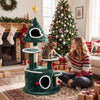 Christmas tree-shaped cat tree with condos, sisal scratching post, and interactive toys for feline fun and comfort.
