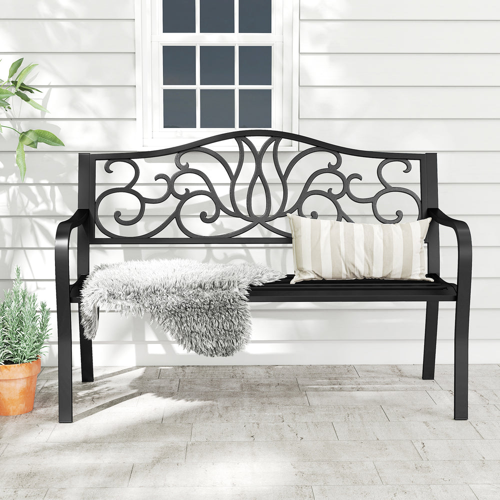 Black 50-inch outdoor garden bench with floral design backrest and slatted seat, perfect for patio or garden gatherings.