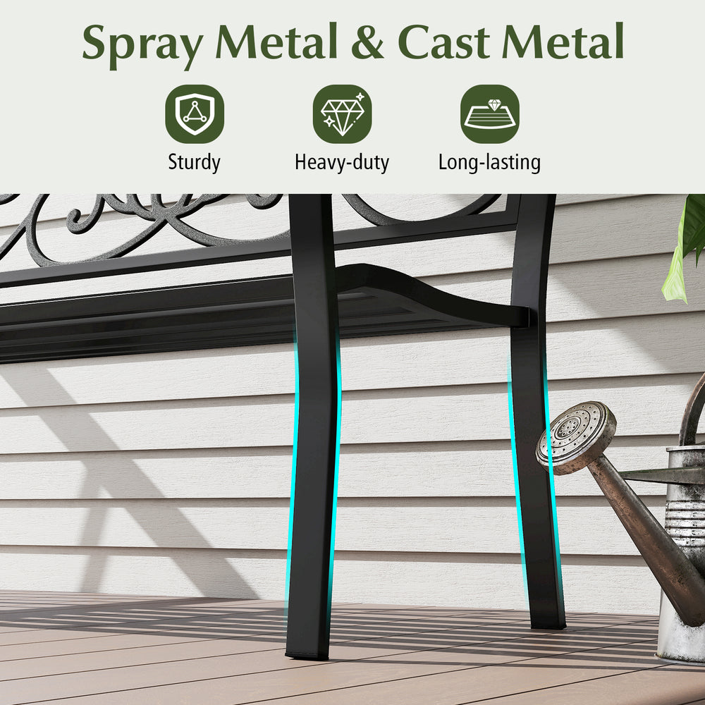 Close-up of the sturdy black metal legs of the 50-inch outdoor garden bench, featuring a floral design for stylish.