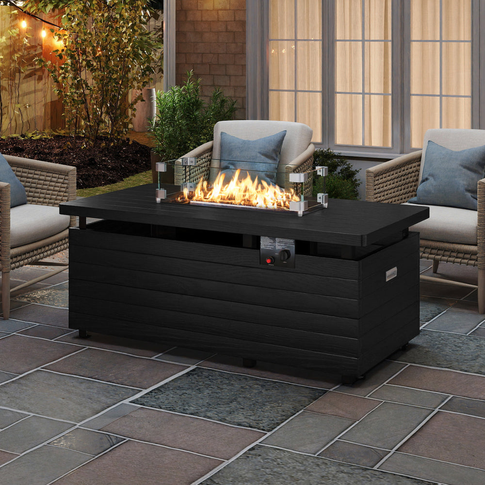 Black 51-inch propane fire pit table with tempered glass wind guard, perfect for enhancing warmth and ambience on your patio.