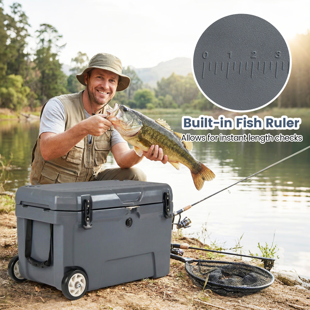 Portable 52 quart hard cooler in gray with wheels, built-in fish ruler, ideal for fishing and outdoor activities.