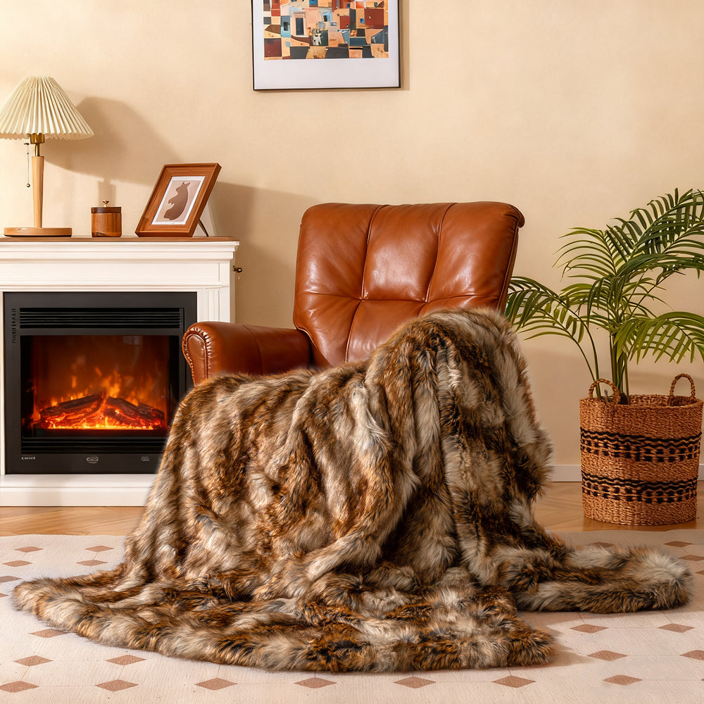 Soft plush fuzzy luxury faux raccoon fur blanket draped over a chair, ideal for cozying up by the fireplace.
