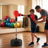 Height adjustable red punching bag with stand for teens and adults, ideal for gym and home training.