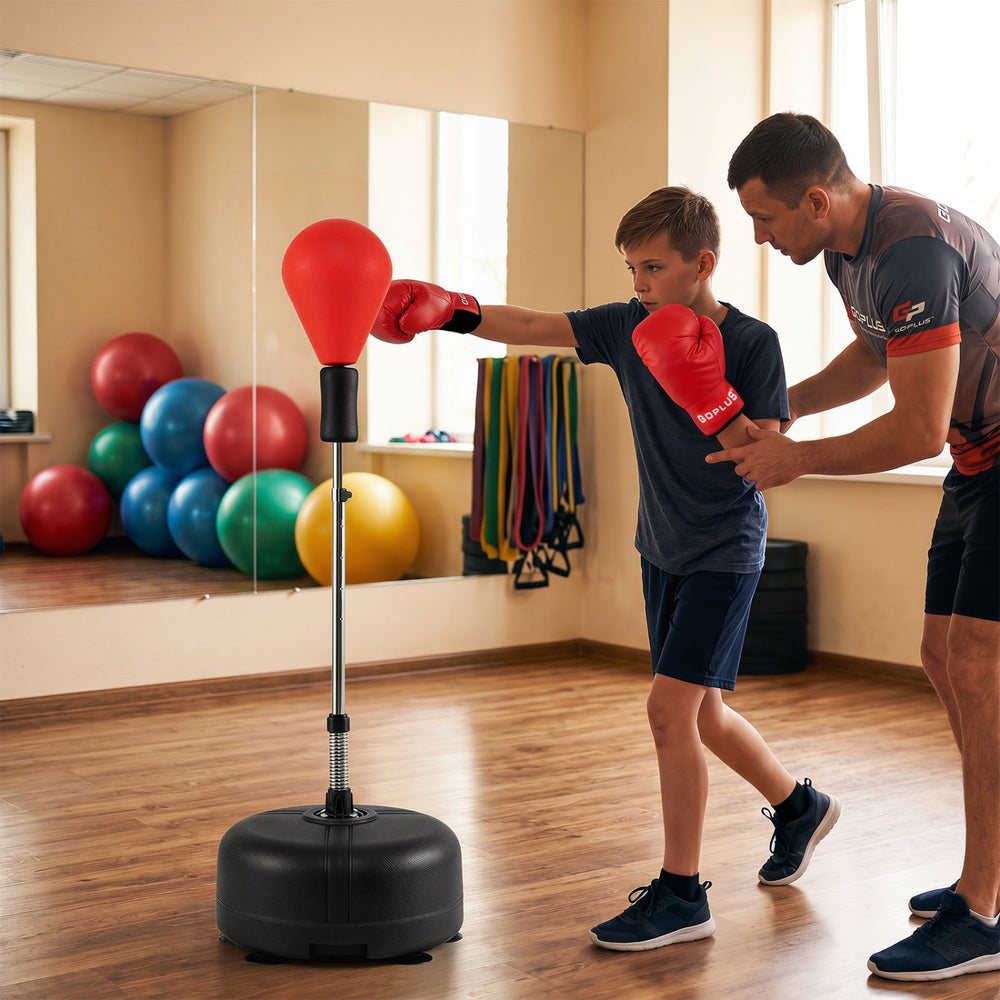 Height adjustable red punching bag with stand for teens and adults, ideal for gym and home training.