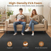 High-density black EVA foam floor tiles provide comfort and shock absorption, ideal for home gym and living room use.