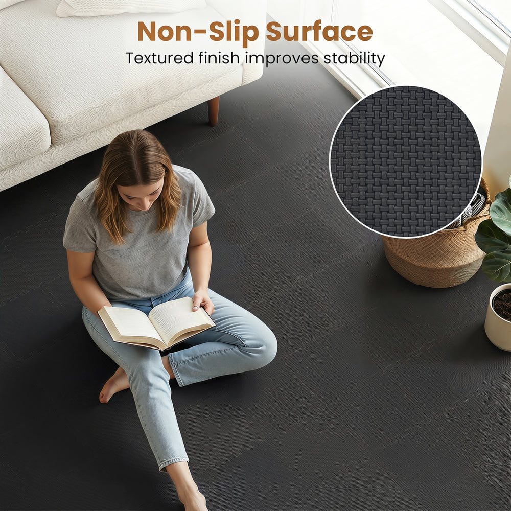 EVA foam floor tiles in black feature a non-slip surface and interlocking design, ideal for home gym and living room use.