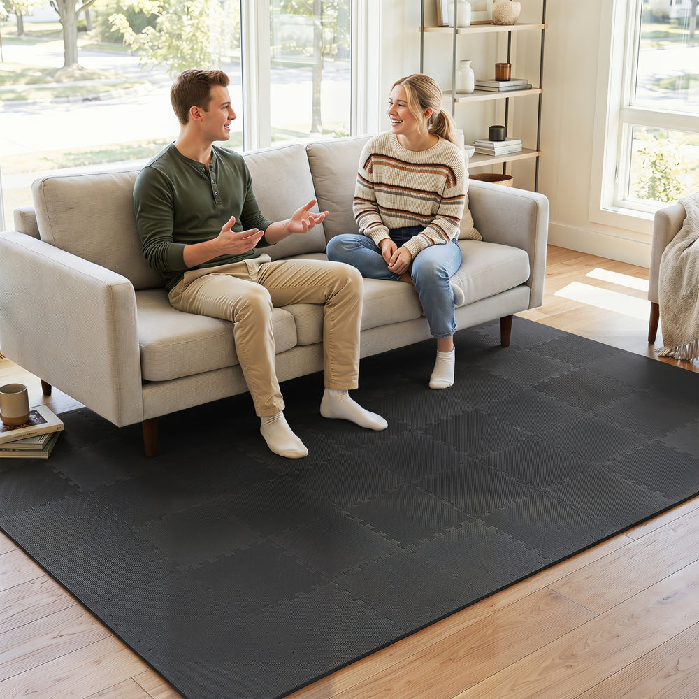 Black EVA foam floor tiles with 0.4" thickness offer shock absorption and non-slip safety for versatile home use.