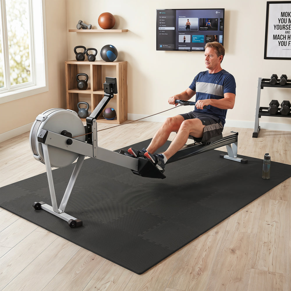 EVA foam floor tiles in black provide a non-slip surface and cushioning for home gym workouts and equipment protection.
