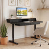 Electric standing desk with drawers in black, featuring ergonomic monitor stand and adjustable height for optimal.