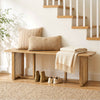 Solid rubber wood dining bench with rattan legs, featuring a natural finish, ideal for entryways or bedrooms.
