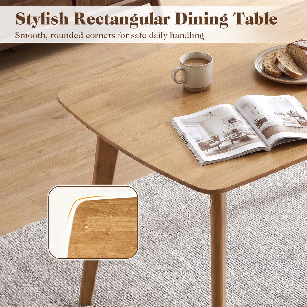 Stylish 55" solid wood dining table with rounded edges, suitable for 4-6 people, perfect for family gatherings.
