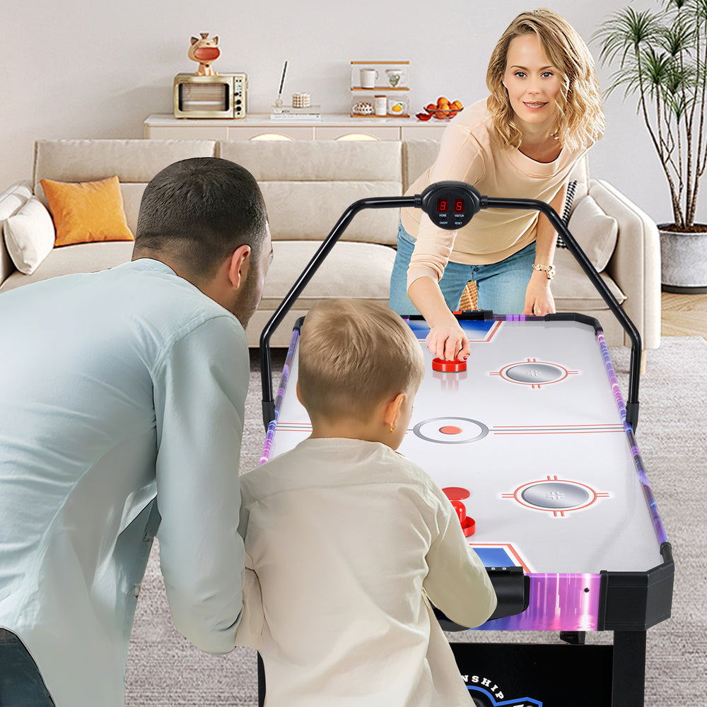 56-inch air hockey table with LED scoreboard, featuring two pushers and pucks, perfect for family fun in the living.