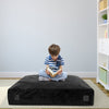 Black 57 x 57 inch crash pad sensory mat with removable velvet cover, perfect for reading, jumping, or napping.