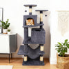 Multi-level 57-inch gray cat tree with dual condos, hammock, and dangling balls for active feline fun and relaxation.