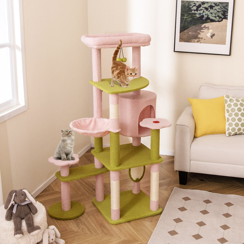 Multi-level cat tree with pink and green design, featuring cozy condo, hammock, and flower-shaped platforms for playful.