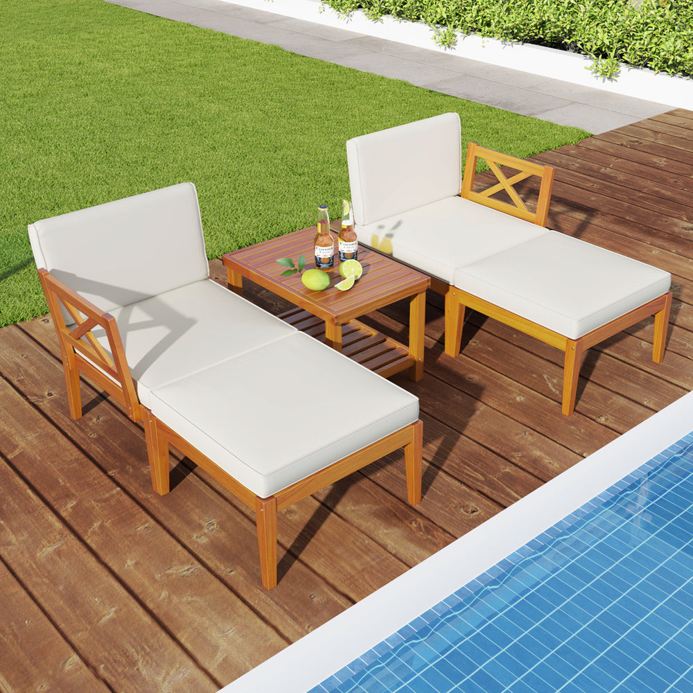Acacia wood patio chaise lounge chair set with white cushions and 2-tier coffee table, perfect for poolside relaxation.