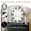Lighted oval mirror with dimmer and rotating design on a black makeup dressing table with cushioned stool for elegant.