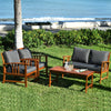 Wooden patio furniture set with cushioned chairs and table, perfect for outdoor relaxation in garden or poolside.