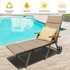 Outdoor rattan chaise lounge chair with adjustable backrest, soft cushion, and wheels for easy transport by the pool.