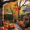 Life-size 5.2 FT orange Halloween skeleton with pumpkin head, showcasing movable joints in a festive outdoor scene.