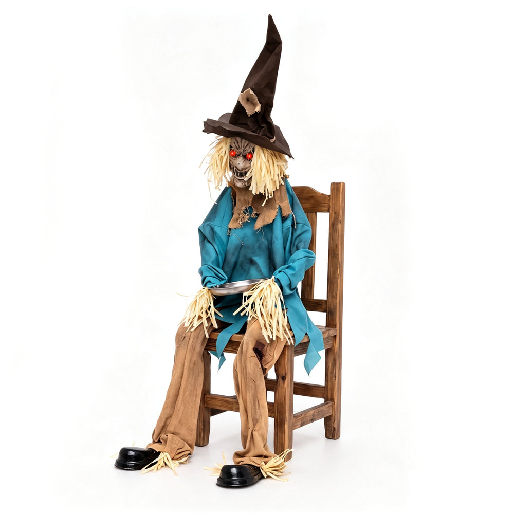 Animated scarecrow decoration with glowing red eyes, tattered clothes, and a stainless steel tray for Halloween fun.