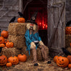 5.2 ft Halloween animatronic scarecrow with glowing red eyes, tattered clothes, and a stainless steel candy tray for spooky displays.