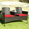 Modern patio conversation set featuring a trapezoid coffee table, red cushions, and durable rattan for outdoor.