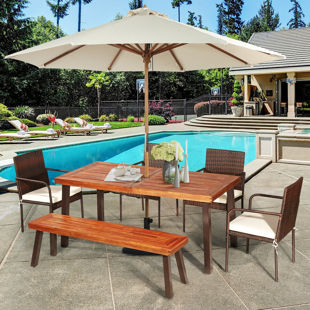 Rectangular acacia wood dining table with steel legs, featuring an umbrella hole, ideal for outdoor patio use.