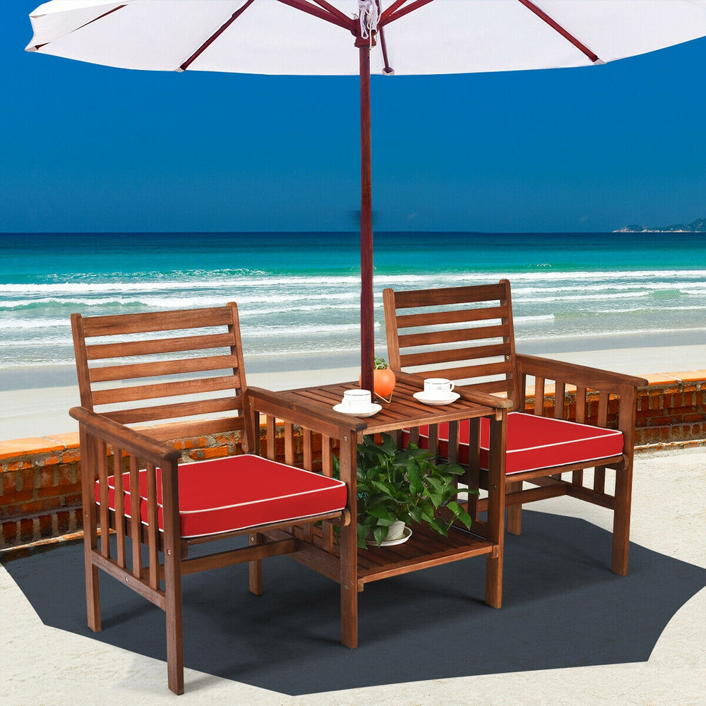 Outdoor patio table and chairs set made of acacia wood with red cushions, perfect for garden or backyard relaxation.