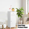 White wooden bathroom storage cabinet with drawer and adjustable shelf, featuring anti-slip foot pads for stability.