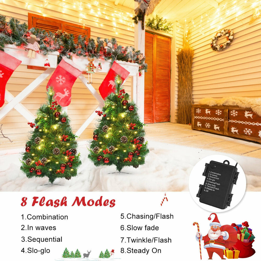 Set of 2 battery-powered 29-inch pre-lit Christmas trees with rich ornaments and 8 light modes for festive decoration.