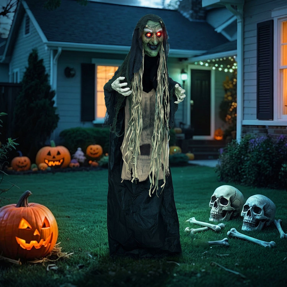 Standing 5.3 FT tall, this hunchback witch prop features light-up eyes and adjustable arms for a spooky outdoor display.