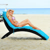 Turquoise folding patio lounge chair with a sleek design, perfect for poolside lounging and easy transportation.