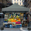 Set of 8 canopy weights with no-pinch design, 40lbs each, ideal for securing tents and canopies at outdoor events.