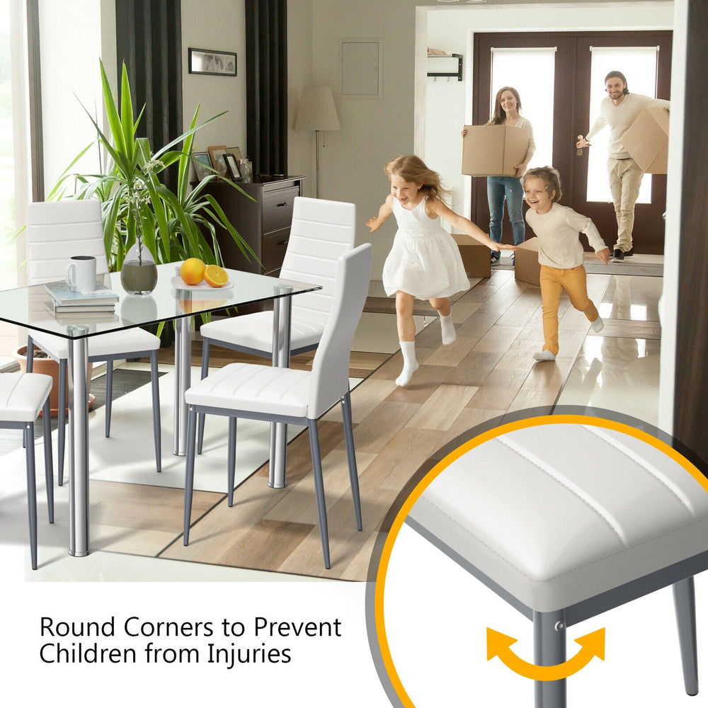 5-piece dining set featuring a clear glass table and 4 PVC leather chairs with round corners for safety.