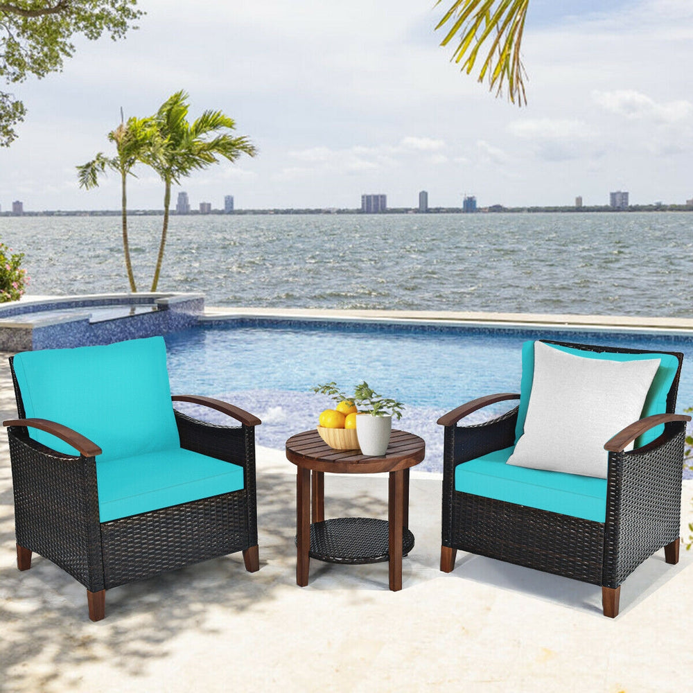 Side view of a turquoise cushioned patio chair with a sturdy acacia wood frame, ideal for outdoor lounging and.