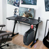 Ergonomic gaming desk showcasing a spacious carbon fiber surface, cup holder, and blue LED lights for an immersive.