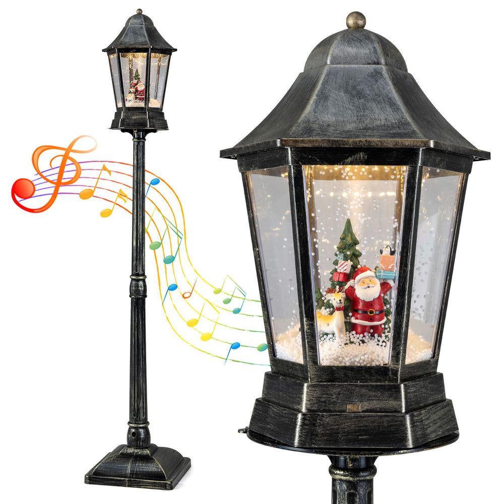 5.4 ft black musical Christmas street lamp with dynamic snowfall, Santa and reindeer figures inside the lantern.