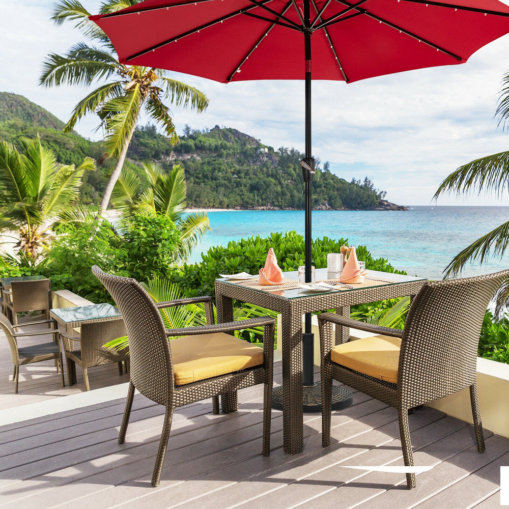 Rattan design patio market umbrella base stand with anti-rust steel tube, ideal for poolside or backyard use.