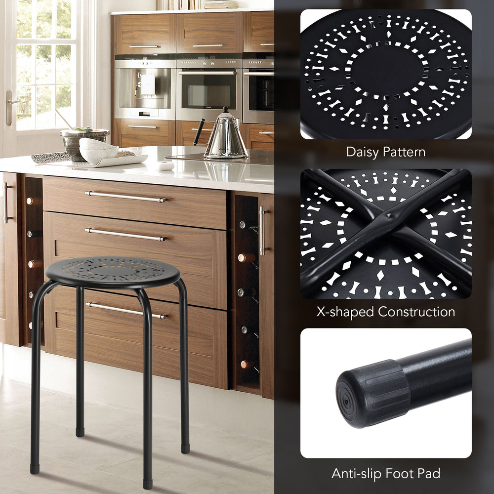 Black backless round metal stool with daisy pattern, stackable design, ideal for indoor and outdoor use.