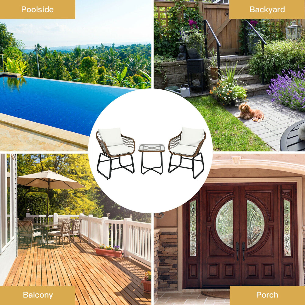 Cushioned armchairs and glass table from the 3 Pieces Patio Rattan Bistro Set for stylish outdoor relaxation.