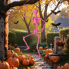 Vibrant pink life-size Halloween skeleton with movable joints, surrounded by pumpkins, creates a festive outdoor scene.