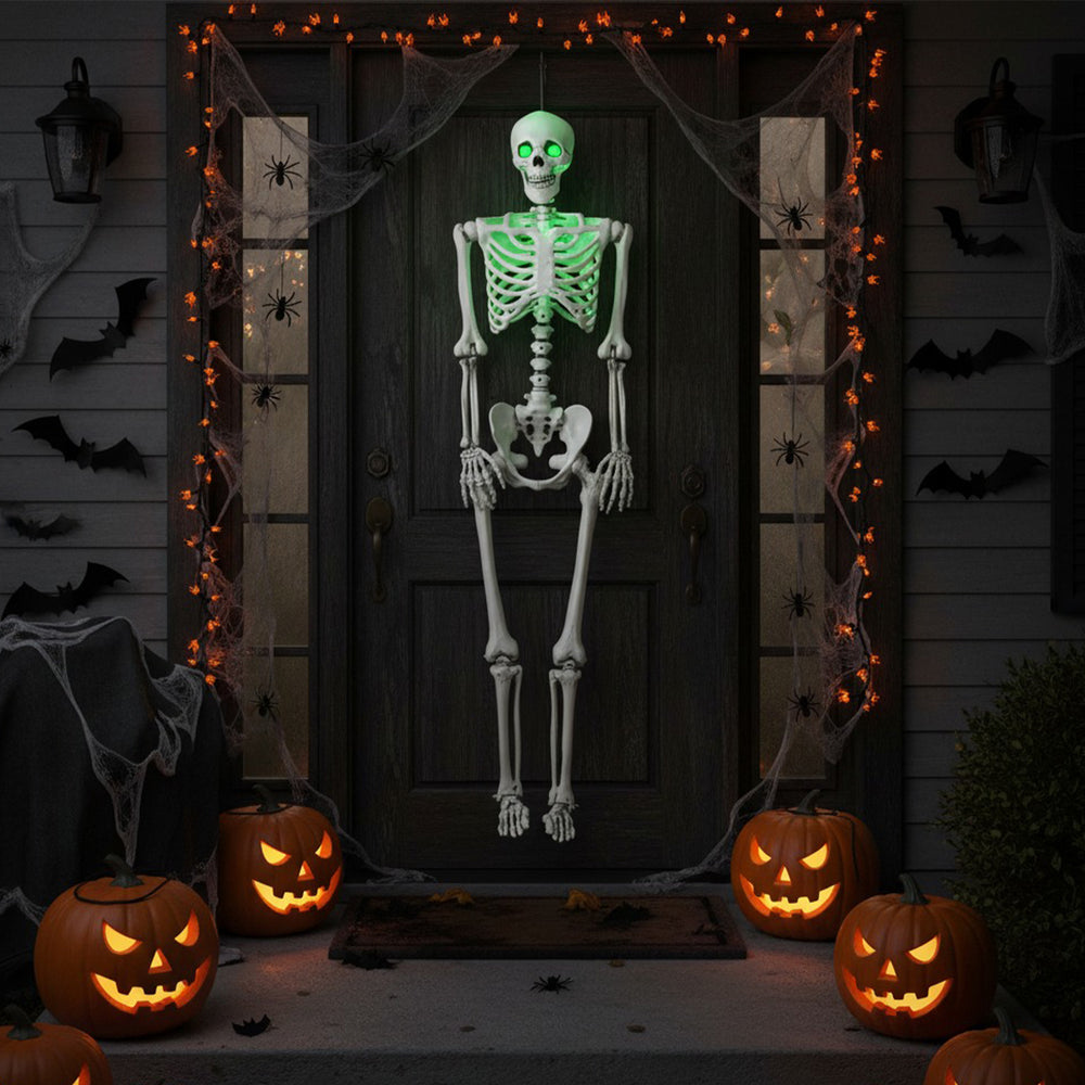 Life-size 5.5 FT Halloween skeleton with green illuminating eyes, perfect for indoor or outdoor spooky decorations.